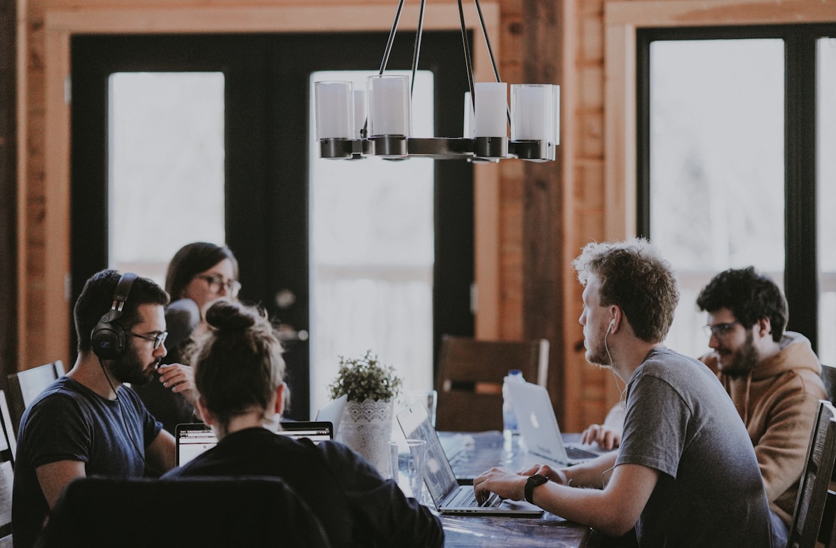 Bluman professionals working together with clients in the office