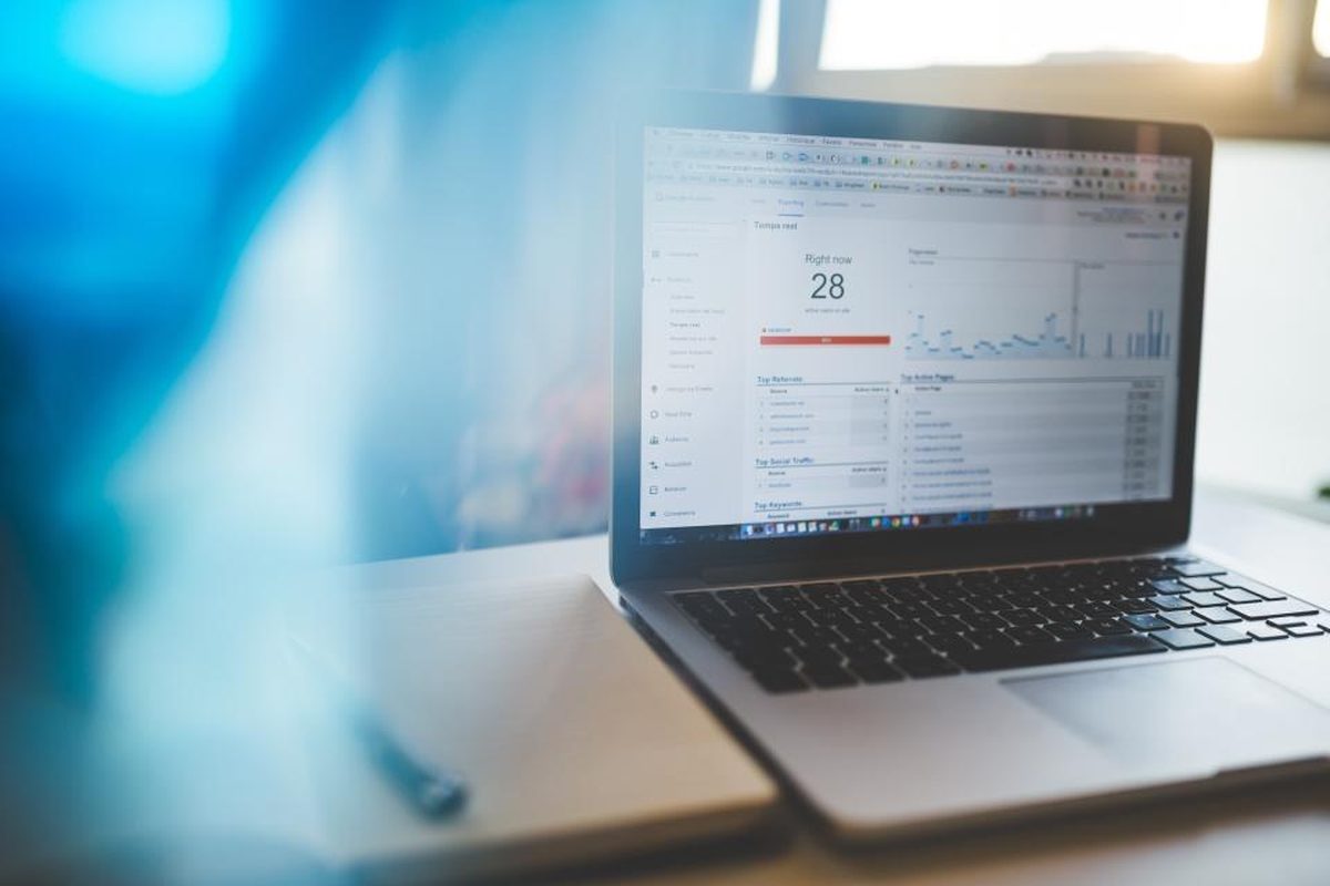 Financial performance charts on a laptop screen