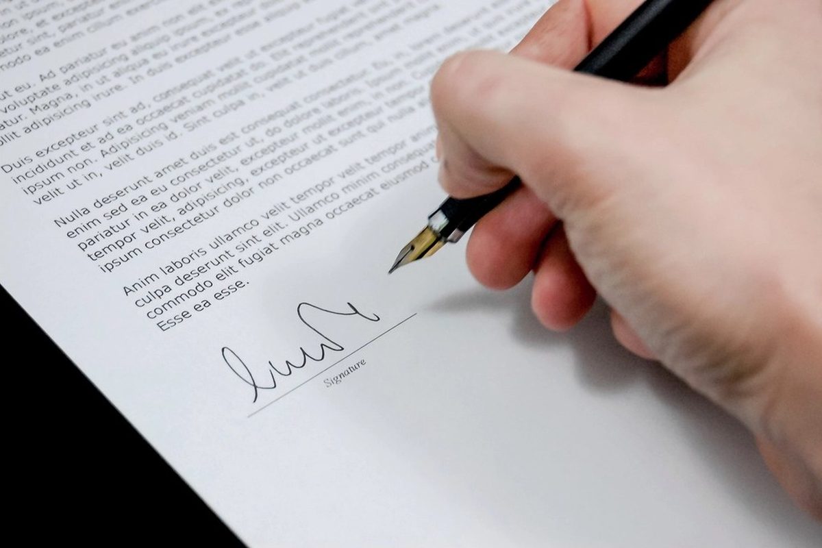 Signing an official document with a fountain pen
